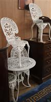 A cast aluminium painted garden table and four chairs Table diameter 69cm                                                              