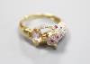 A modern Cartier style 585 yellow metal, pink topaz?, ruby and diamond encrusted leopard ring                                                                                                                               