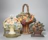 A group of six cast iron or brass door-stops, four painted. Tallest 38cm                                                                                                                                                    