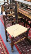 A set of eight oak rushseat ladderback chairs                                                                                          