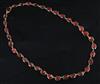 A Victorian gold and foiled back oval cut garnet necklace, approx. 36cm.                                                               