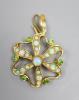 An Edwardian Art Nouveau yellow metal, opal and demantoid garnet cluster set pendant brooch                                                                                                                                 