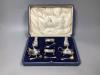 A George V cased silver six piece condiment set, Birmingham, 1927.                                                                                                                                                          