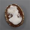 A 9ct mounted oval cameo brooch, carved with the bust of a lady to sinister, 41mm                                                      