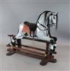 A Robert Foster of Hartfield dapple grey rocking horse, dated 1997, length 5ft height 4ft                                              