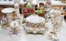 A group of Continental porcelain and pottery figural vases and centrepieces and two candelabra                                                                                                                              