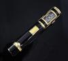 A gilded black enamel combination lipstick holder/watch, 7cm.                                                                          