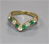 A modern 18ct gold, emerald and diamond wishbone ring, size O.                                                                         