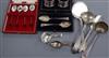 Three cased stes including silver and enamel spoons and napkin rings and six items of silver/white metal flatware.                     