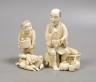 A Japanese ivory group of a farmer and boy, early 20th century, farmer 11.5 cms high.                                                                                                                                       