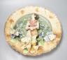 A Continental terracotta wall plaque and a Poutney & Co plaque (2) 39cm                                                                                                                                                     