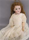 A Tete Jumeau doll on stand approx. length 48cm                                                                                        