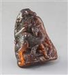 A Chinese amber boulder carving, Qing dynasty, height 7.5cm                                                                            