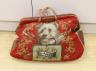 A 19th century Berlin beadwork and leather travel bag, designed one side with a King Charles Spaniel and other with a Terrier and message ‘Bon Voyage’, 46 cms wide x 35 high.                                              