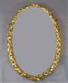 An early 19th century giltwood and gesso oval wall mirror, W.1ft 10in. H.2ft 9in.                                                      