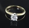 A 14ct gold and solitaire diamond ring, size M.                                                                                        
