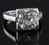A 1940's? platinum and solitaire diamond ring, the old round cut stone weighing approximately 3.30cts,                                 