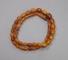 A single strand graduated oval amber bead necklace, 48cm, gross weight 17 grams.                                                                                                                                            