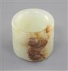 A good Chinese pale celadon and russet jade archer's ring, 18th/19th century, height 2.5cm, diameter 2.8cm                             