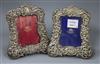 A pair of Edwardian silver mounted photograph frames, by Goldsmiths & Silversmiths Co Ltd, London, 1903, 20cm.                         