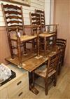 A 1920's oak refectory dining table and six rustic ladder back chairs, two with arms table length 152cm                                