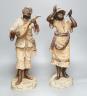 A pair of terracotta musician figures, incised numbers to base, 49cm                                                                                                                                                        