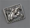 A Georg Jensen sterling silver twin dolphin and scrolling leaf branch rectangular brooch, no. 251, 37mm.                               