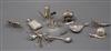 A Victorian silver caddy spoon, a similar silver miniature 'chocolate pot' pepperette and teapot and twelve other items.               