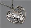A Georg Jensen sterling silver heart shaped robin pendant, no. 97, on chain, pendant 40mm.                                             