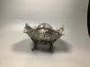 A late Victorian embossed silver fruit bowl, decorated with scrolls, baskets of fruit and masks, by Walter & John Barnard                                                                                                   