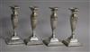 A set of four Edwardian fluted silver candlesticks, Marks & Cohen, Birmingham, 1906, 16.2cm.                                           