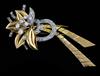 A mid 20th century French 18ct gold and diamond set stylised flower head clip brooch, 79mm.                                            