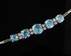 A mid 20th century white gold, graduated blue zircon and diamond set bracelet, approx. 16cm.                                           