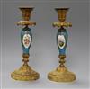 A pair of French gilt metal and porcelain candlesticks                                                                                 