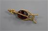 A late Victorian ropetwist yellow metal and cabochon garnet set brooch (a.f. pin broken),                                              