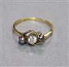 A yellow metal diamond and Tahitian cultured pearl three stone ring, size O.                                                           