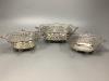 An Edwardian graduated set of three pierced silver shaped rectangular bonbon dishes by William Comyns                                                                                                                       