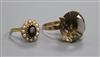 A 9ct gold and smoky quartz dress ring and a 9ct gold garnet and seed pearl oval cluster ring.                                         