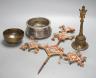 A Himalayan brass bell and bowl, a woolwork finial, 43 cm high, an Islamic tinned metal censer (4)                                                                                                                          