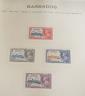 Three stamp albums with 1935 Silver Jubilee mint set of 250 including Egypt, 1937 Coronation two mint sets plus some used                                                                                                   