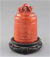 A Chinese coral red glazed model of a temple bell, Republic period, height 11cm, wood stand                                            