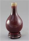 A Chinese Langyao sang de boeuf glazed bottle vase, 18th century, height 15cm. wood stand                                              