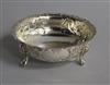 A Victorian embossed silver sugar bowl, on claw and ball feet, Robert Harper, London, 1874, 12.1cm.                                    