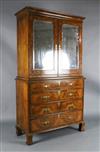 An early 18th century figured and burr walnut cabinet on chest, W.3ft 8in. D.1ft 8in. H.6ft 6.5in.                                     