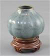 A Chinese Jun-type lobed ovoid vase, 17th/18th century, height 6cm, wood stand                                                         