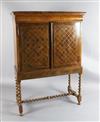 A William and Mary walnut cabinet on stand, W.3ft 6in. D.1ft 7in. H.4ft 11in.                                                          