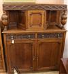 A 1920's oak court cupboard W.137cm                                                                                                    