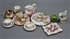 A group of miniature china including teasets, cup and saucers, jugs, etc.                                                              