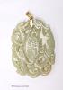 A Chinese yellow metal amounted jade pendant, 63mm, carved with dragons and character marks.                                                                                                                                