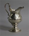 A George III silver inverted pear shaped cream jug, London, 1781, 12.3cm.                                                              